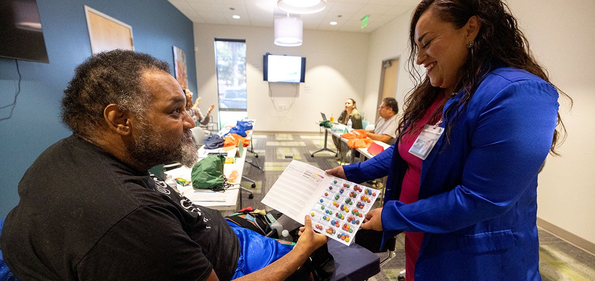 behavioral health data reforms - Case manager leads wellness group meeting